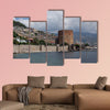 Seascape with Red tower and castle wall of Alanya shot on cloudy day multi panel canvas wall art