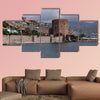 Seascape with Red tower and castle wall of Alanya shot on cloudy day multi panel canvas wall art