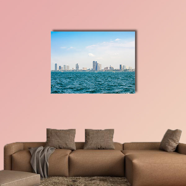 Speed boats and city buildings near the sea, sky and clouds  wall art