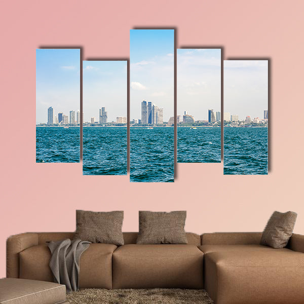 Speed boats and city buildings near the sea, sky and clouds  wall art