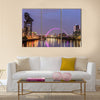 Night lights and the Clyde Arc Bridge at Glasgow City in Scotland over river. Multi Panel Canvas Wall Art