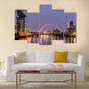 Night lights and the Clyde Arc Bridge at Glasgow City in Scotland over river. Multi Panel Canvas Wall Art