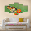 A beautiful Monarch Butterfly feeding on a Lantana bloom Multi Panel Canvas Wall Art