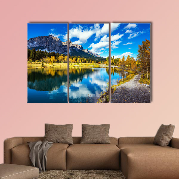 The path and yellowing aspens surround the lake multi panel canvas wall art