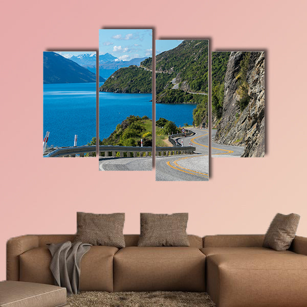 Winding road along mountain cliff and lake landscape in canvas wall art