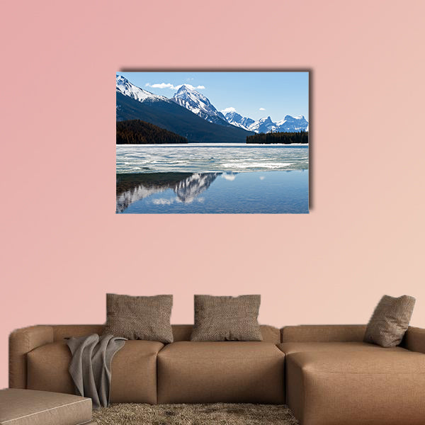 Snow covered Rocky mountains peaks reflected on the half wall art