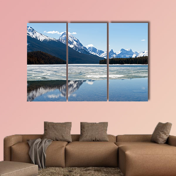 Snow covered rocky mountains peaks reflected canvas wall art