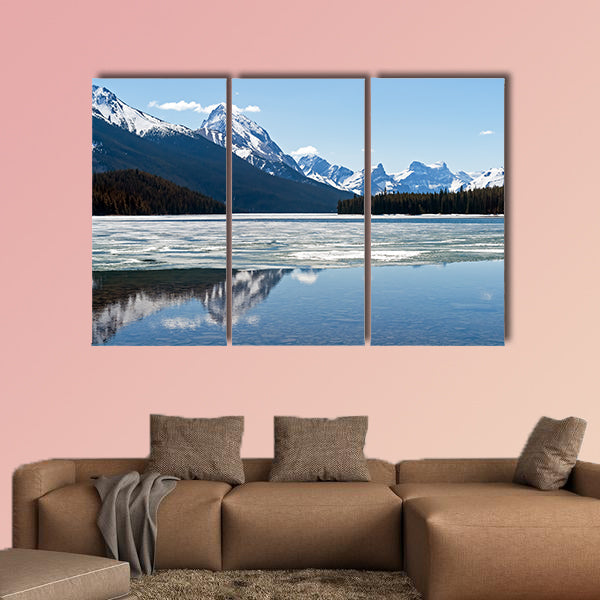 Snow covered Rocky mountains peaks reflected on the half wall art