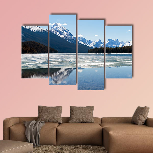 Snow covered rocky mountains peaks reflected canvas wall art