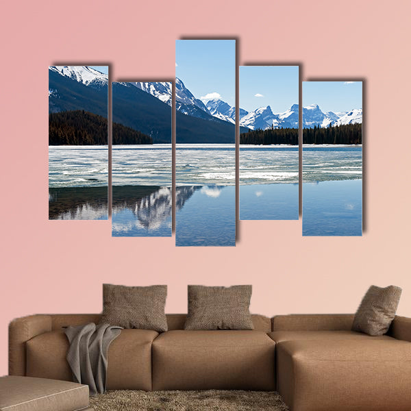 Snow covered rocky mountains peaks reflected canvas wall art
