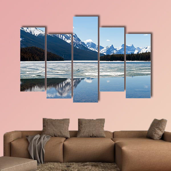 Snow covered Rocky mountains peaks reflected on the half wall art