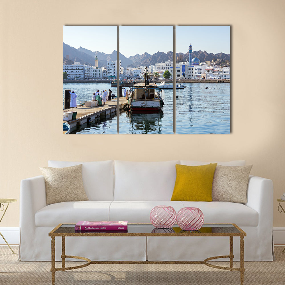 Fishermen at The Muttrah Fish docks multi panel canvas wall art
