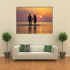 The image of two people in love at sunset multi panel canvas wall art