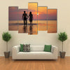 The image of two people in love at sunset multi panel canvas wall art