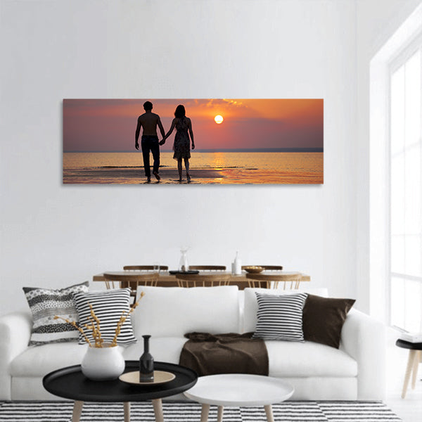 The image of two people in love at sunset panoramic canvas wall art