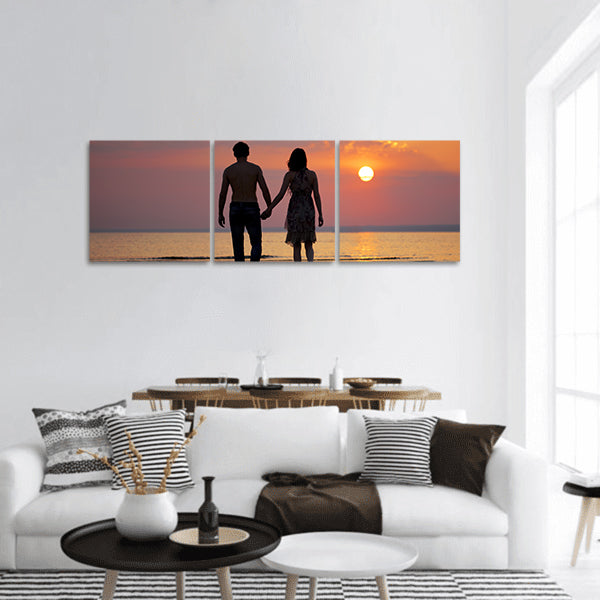 The image of two people in love at sunset panoramic canvas wall art