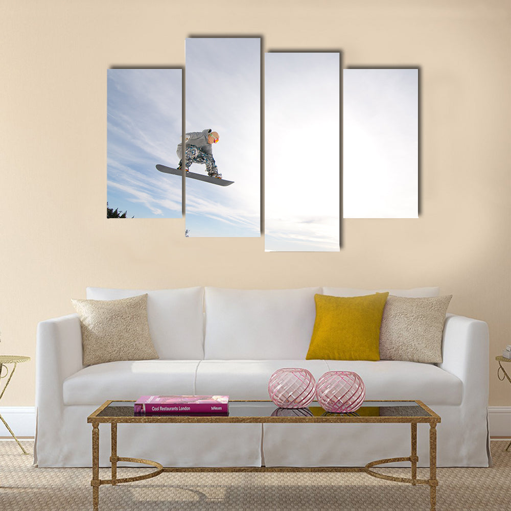 Men Snowboarder Catches Big Air on a Bright Sunny Day Multi panel canvas wall art