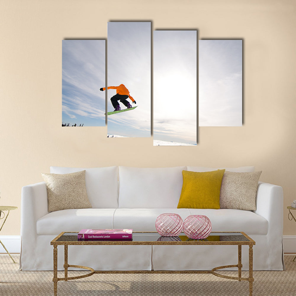 Male Snowboarder Catches Big Air on a Bright Sunny Day Multi panel canvas wall art