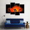 Military silhouettes of soldiers against the backdrop Multi panel canvas wall art