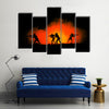 Military silhouettes of soldiers against the backdrop Multi panel canvas wall art