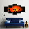 Military silhouettes of soldiers against the backdrop Multi panel canvas wall art