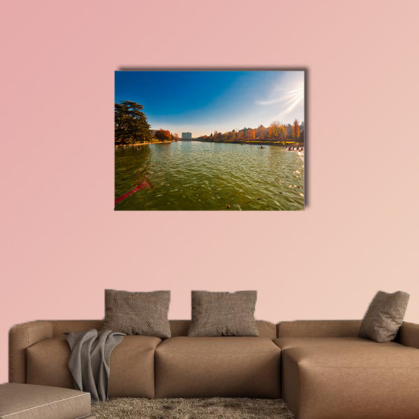 Winter day in City Lake, with sunlight on canoeist’s multi panel canvas wall art