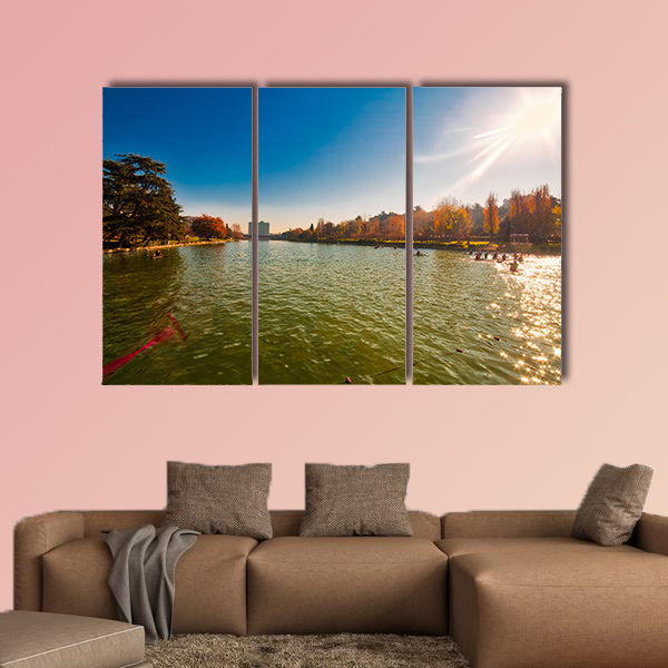 Winter day in City Lake, with sunlight on canoeist’s multi panel canvas wall art