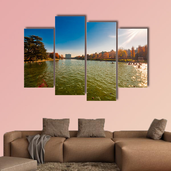 Winter day in City Lake, with sunlight on canoeist’s multi panel canvas wall art