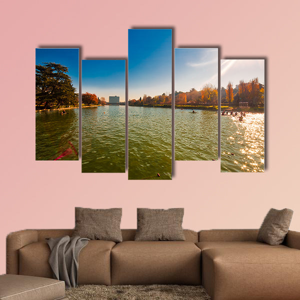 Winter day in City Lake, with sunlight on canoeist’s multi panel canvas wall art