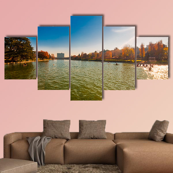 Winter day in City Lake, with sunlight on canoeist’s multi panel canvas wall art