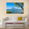 Wooden pier at Lake Atitlan on the shore at Panajachel, Guatemala Multi panel canvas wall art