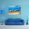 Unidentified tourists sailing in a boat on a Caribean beach in Taganga Colombia Multi Panel Canvas Wall Art