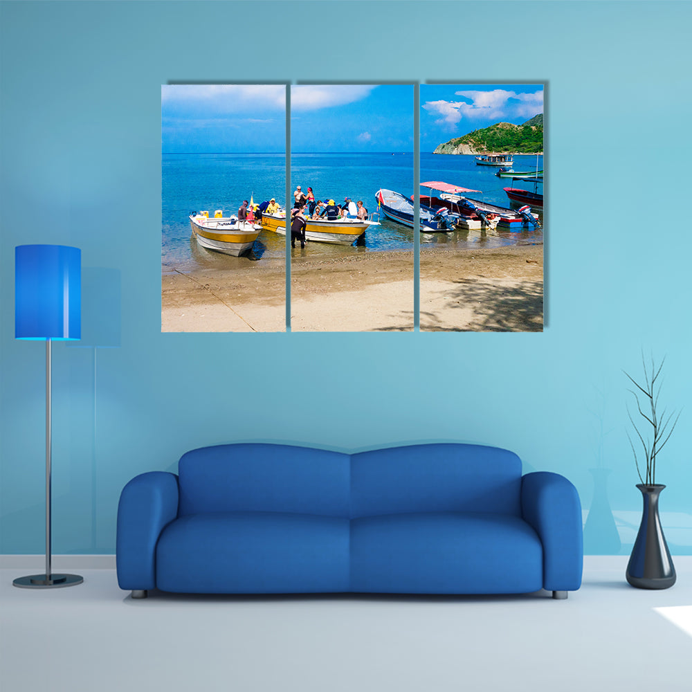 Unidentified tourists sailing in a boat on a Caribean beach in Taganga Colombia Multi Panel Canvas Wall Art