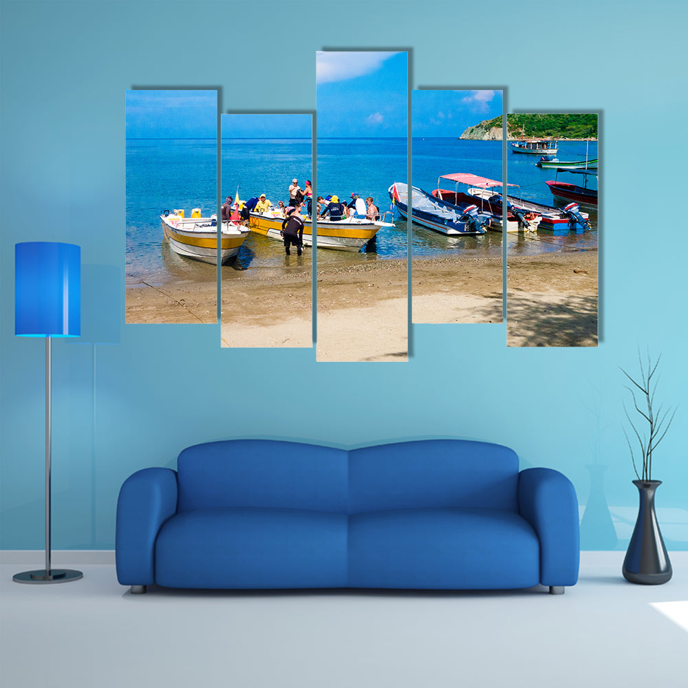 Unidentified tourists sailing in a boat on a Caribean beach in Taganga Colombia Multi Panel Canvas Wall Art