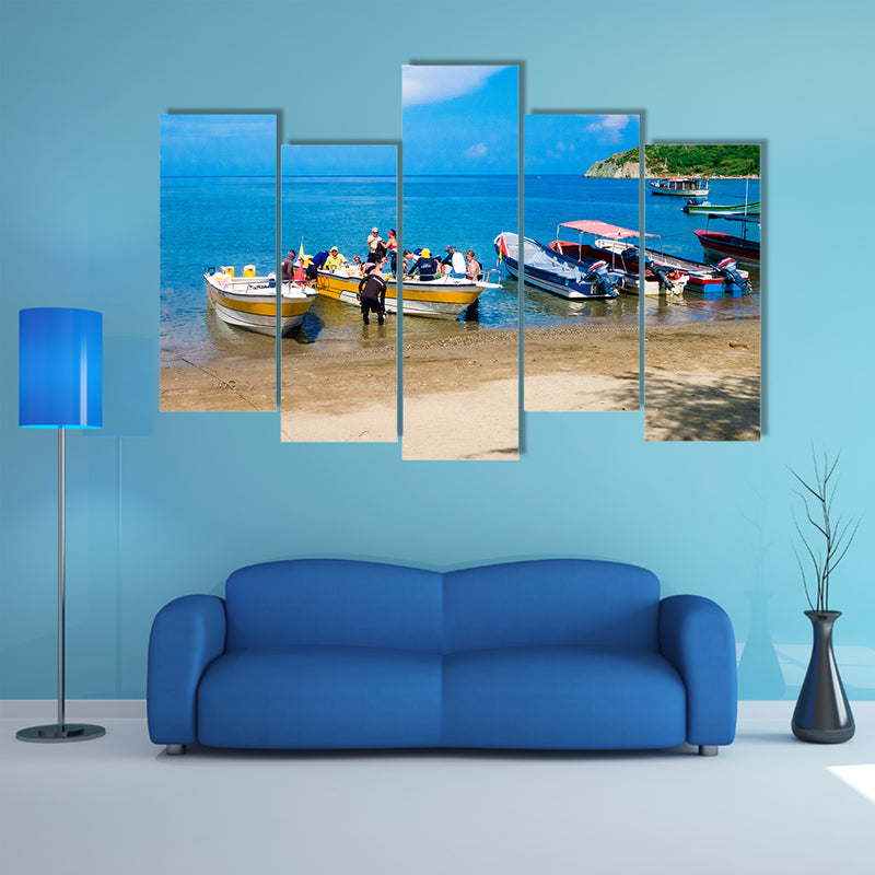 Unidentified tourists sailing in a boat on a Caribean beach in Taganga Colombia Multi Panel Canvas Wall Art