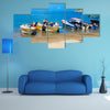 Unidentified tourists sailing in a boat on a Caribean beach in Taganga Colombia Multi Panel Canvas Wall Art