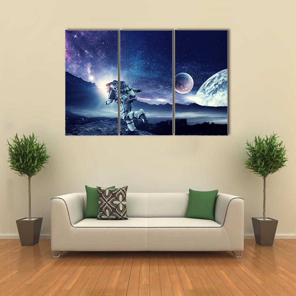 Astronaut Landing On Space Pulling Planet On Rope Multi Panel Canvas Wall Art Print Set