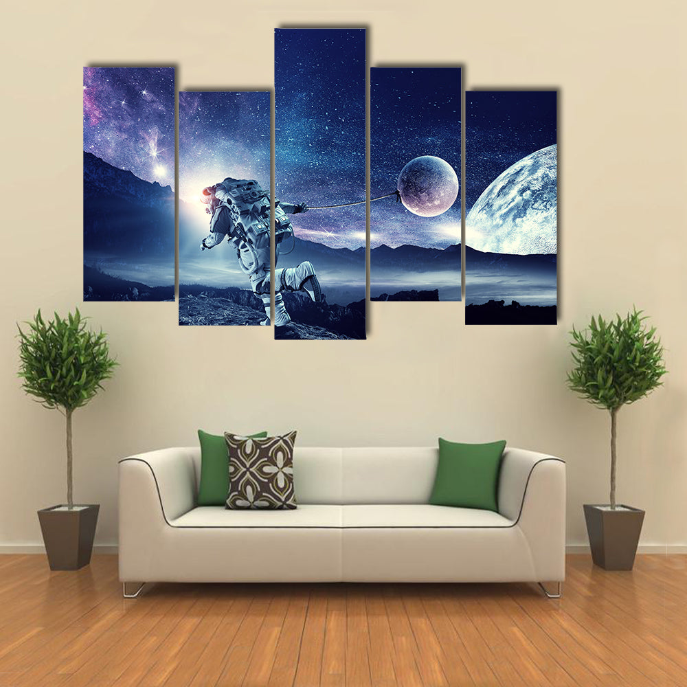 Astronaut Landing On Space Pulling Planet On Rope Multi Panel Canvas Wall Art Print Set