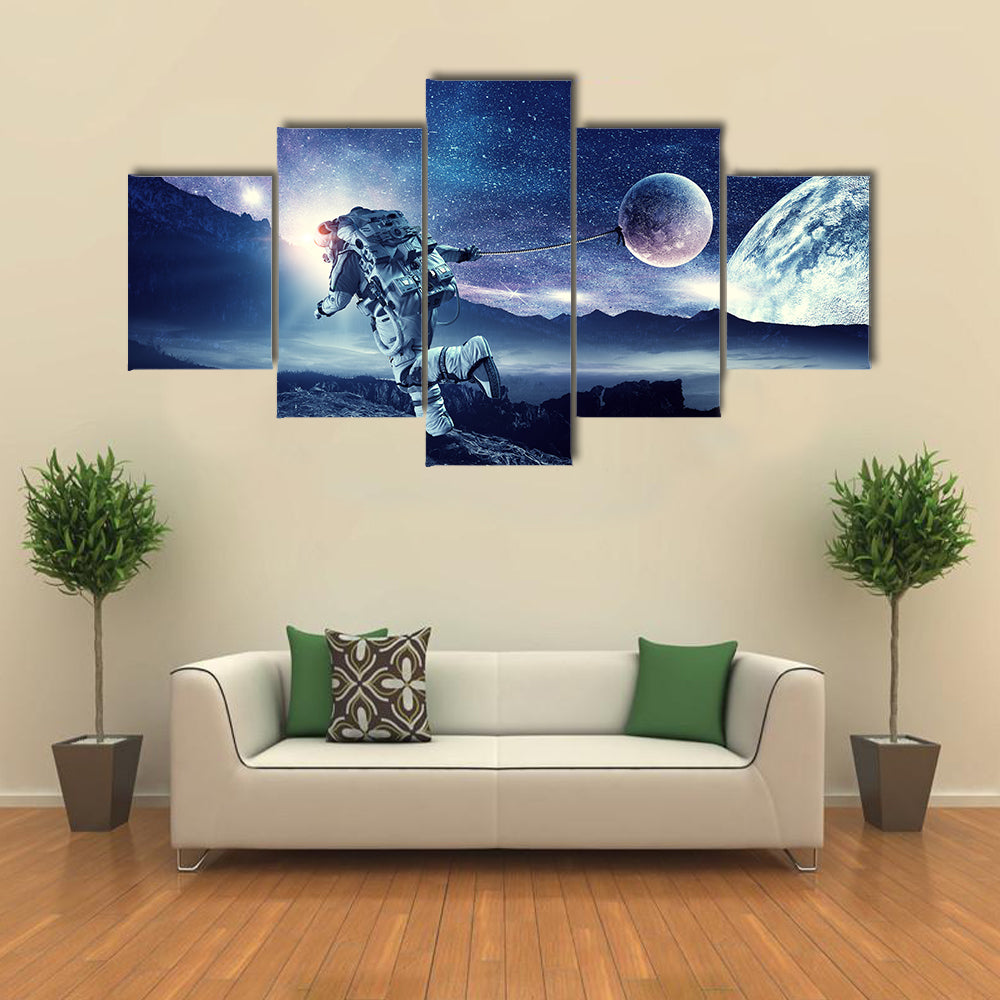 Astronaut Landing On Space Pulling Planet On Rope Multi Panel Canvas Wall Art Print Set