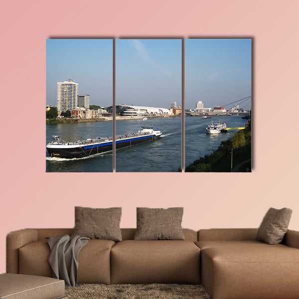  Black cargo ship passing and white cruise ship in Germany wall art