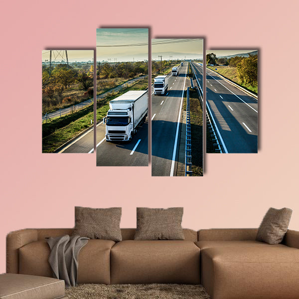 Caravan of white trucks in line on country highway wall art