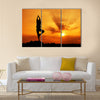 Silhouette of a beautiful Yoga woman in the morning Multi panel canvas wall art