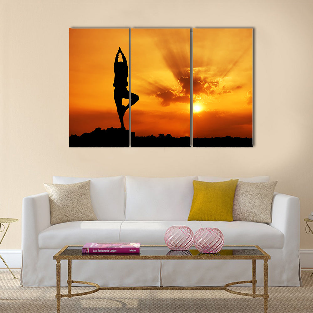 Silhouette of a beautiful Yoga woman in the morning Multi panel canvas wall art