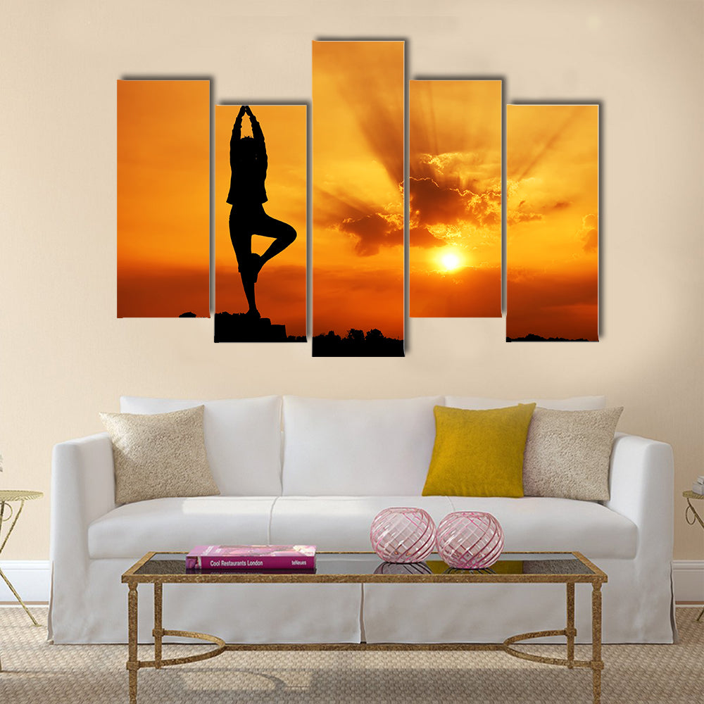 Silhouette of a beautiful Yoga woman in the morning Multi panel canvas wall art