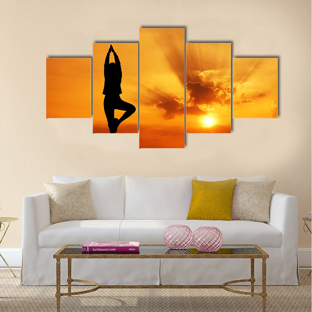 Silhouette of a beautiful Yoga woman in the morning Multi panel canvas wall art