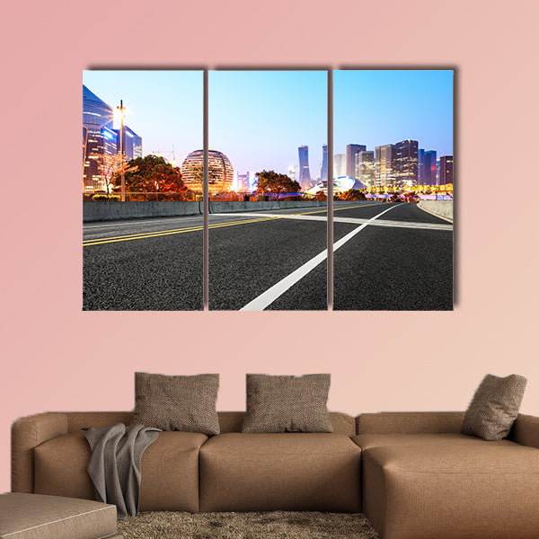 Asphalt highway and modern city buildings multi panel canvas wall art