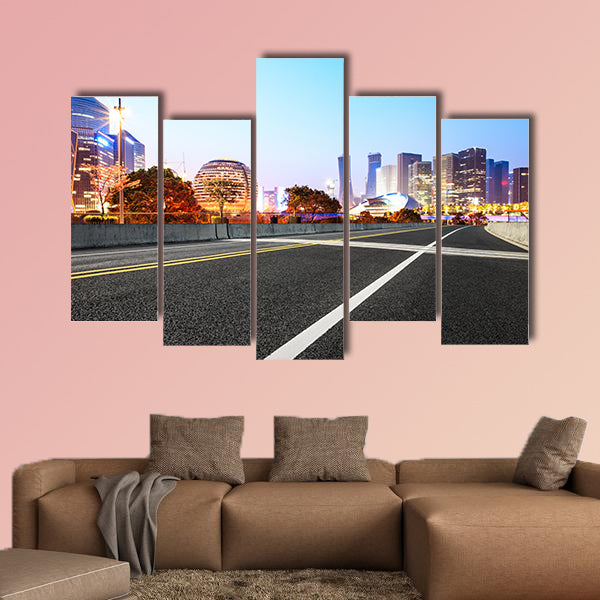 Asphalt highway and modern city buildings multi panel canvas wall art