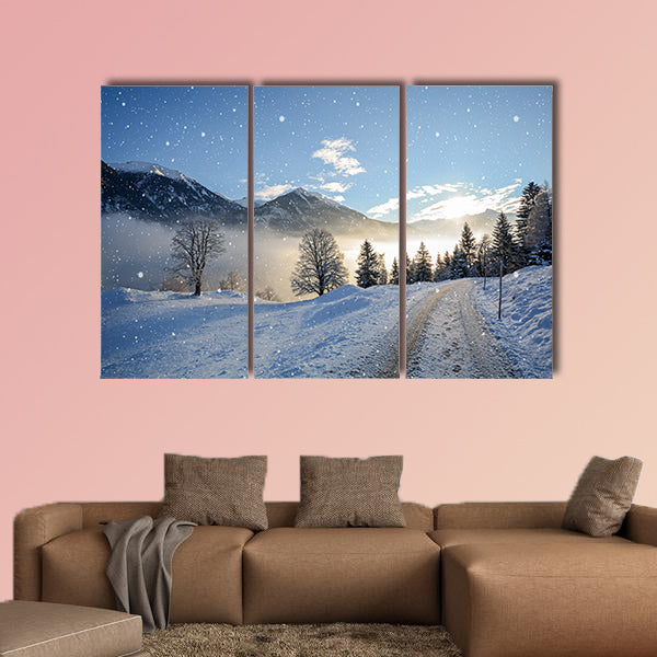 View of an icy road with snowfall and mountain range wall art