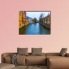 The evening shot of historic buildings in Bruges, Belgium multi panel canvas wall art