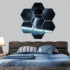 Dark asteroids flying close to planets hexagonal canvas wall art